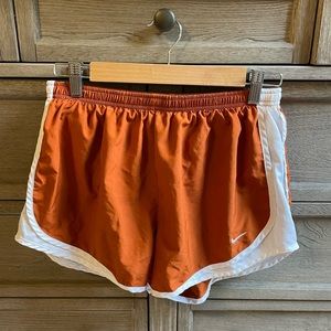 Nike women’s running shorts. Burnt orange and white. Size L.